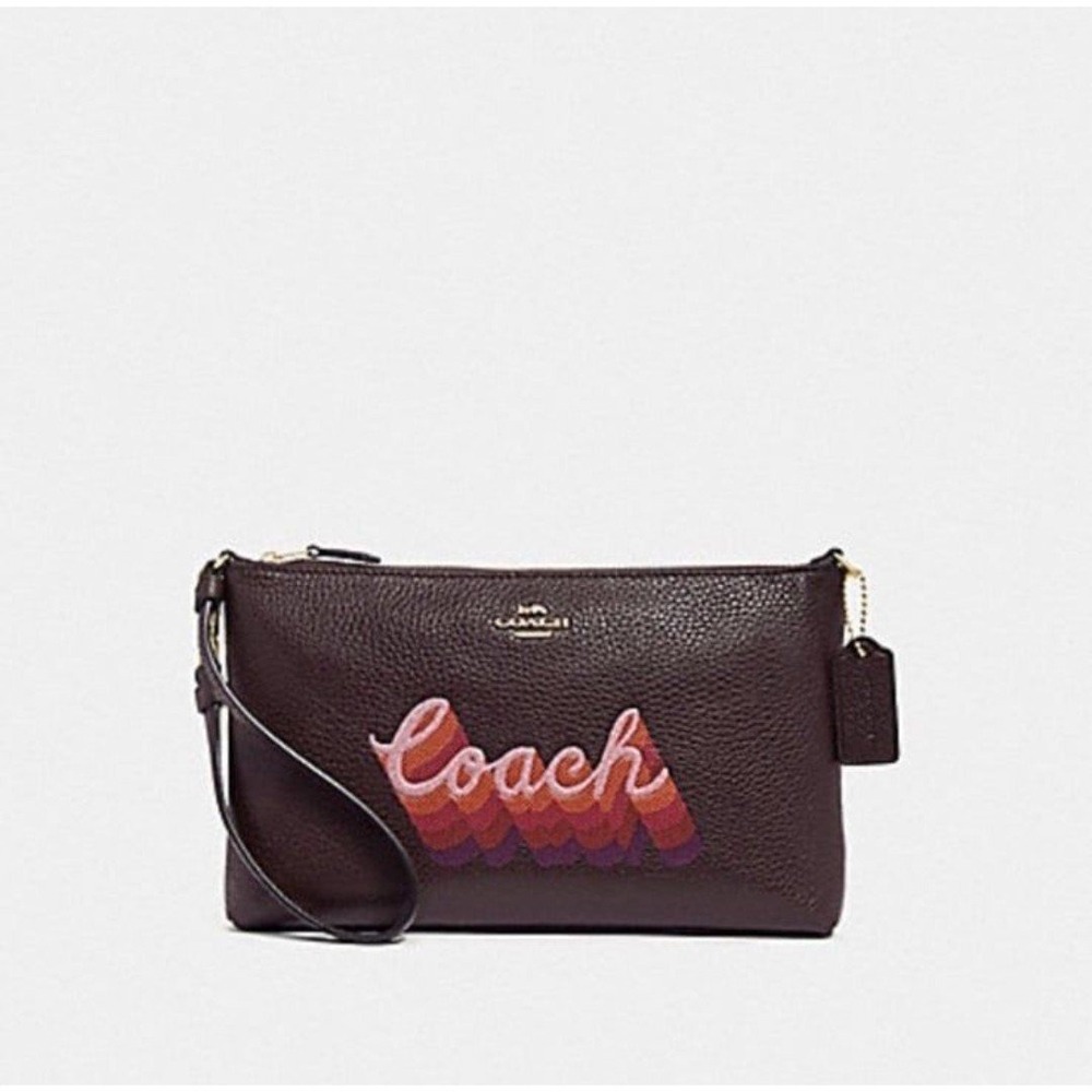 LARGE WRISTLET 25 WITH NEON COACH SCRIPT COACH NWT